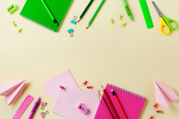Notebook, colored pencils, ruler, pen, eraser, sharpener and more. School and office stationery on yellow background. Concept back to school. Top view.