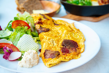 omelet with ham tomato and green salad