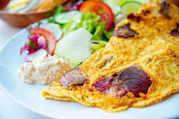 omelet with ham tomato and green salad
