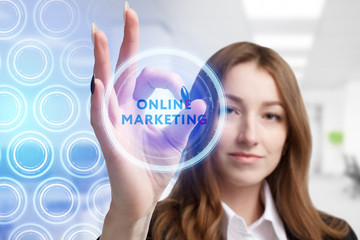 The concept of business, technology, the Internet and the network. A young entrepreneur working on a virtual screen of the future and sees the inscription: Online marketing
