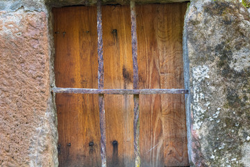 old windows in a rural house with bars