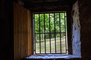 old windows in a rural house with bars