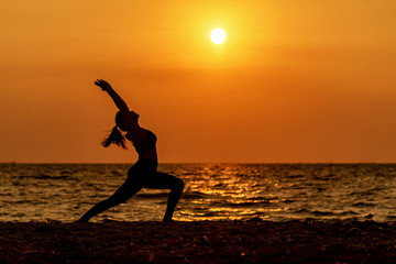 Balance meditation yoga spirit life mind woman peace vitality, silhouette outdoors on the Sea sunset, relax vital abstract. Healthy Life and Lifestyle Concept