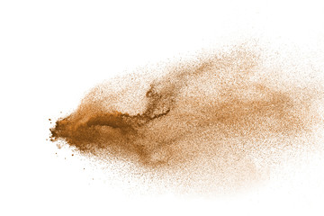 Brown powder explosion isolated on white background.