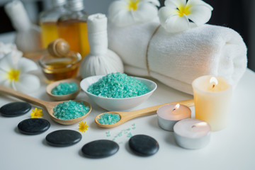 Fototapeta na wymiar Thai spa massage compress balls and salt spa objects on table background, wellness and relaxation concept