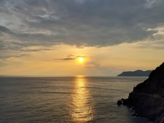 Fototapeta premium Liguria, Italy - 09/15/2019: Travelling around the ligurian seaside in summer days with beautiful view to the famous places. An amazing caption of the water and the sky reflection with blue sky.