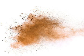 Fototapeta na wymiar Explosion of brown powder on white background. 