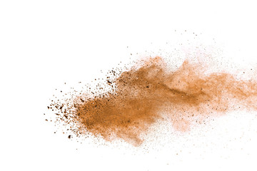 Naklejka na ściany i meble Explosion of brown powder on white background. 