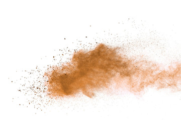 Plakat Explosion of brown powder on white background. 