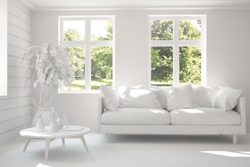 Mock up of stylish room in white color with sofa and green landscape in window. Scandinavian interior design. 3D illustration