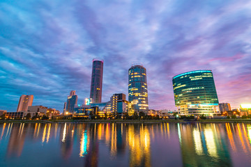 Night cityscape of Yekaterinburg, Russia with city lights reflecting in water