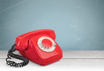 Old fashioned phone  on background