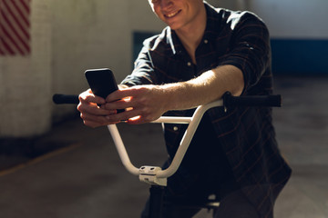 BMX rider in an empty warehouse