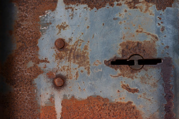 Antique iron keyhole that rust for background.