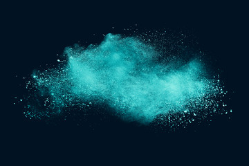 Explosion of aqua color powder on black background. 