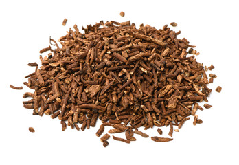 Dried medicinal herbs raw materials isolated on white. Root of Taraxacum