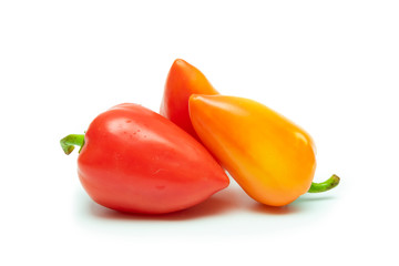 sweet peppers of red and yellow color on a white background as isolate