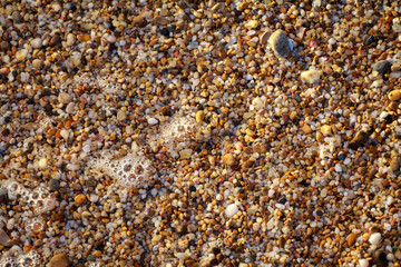 sea pebbles colored granite on the beach