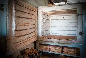 Electric oven for ceramic clay products. Front view of the empty ceramic kiln. Heater for electric stoves and oven