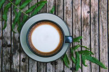 Obraz na płótnie Canvas Cup of coffee on wooden table.