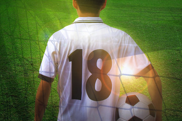 Asian soccer player holding ball