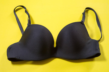 Black bra on yellow background