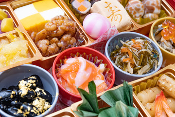 boxes with New Year dishes japanese food (osechi)