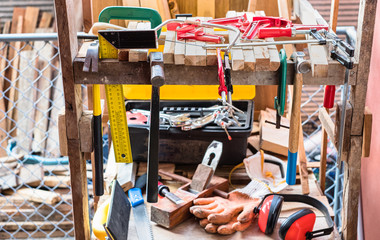 Wood working hand tools on wooden shelf.