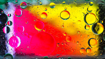 Colorful artistic image of oil drop on water for modern and creation design background.