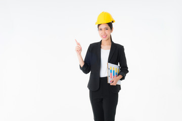 Asian young engineer woman Yellow Safety helmet with clipboard and document in hand Construction and architectural industry One hand is pointing up something a copy space isolated on white background