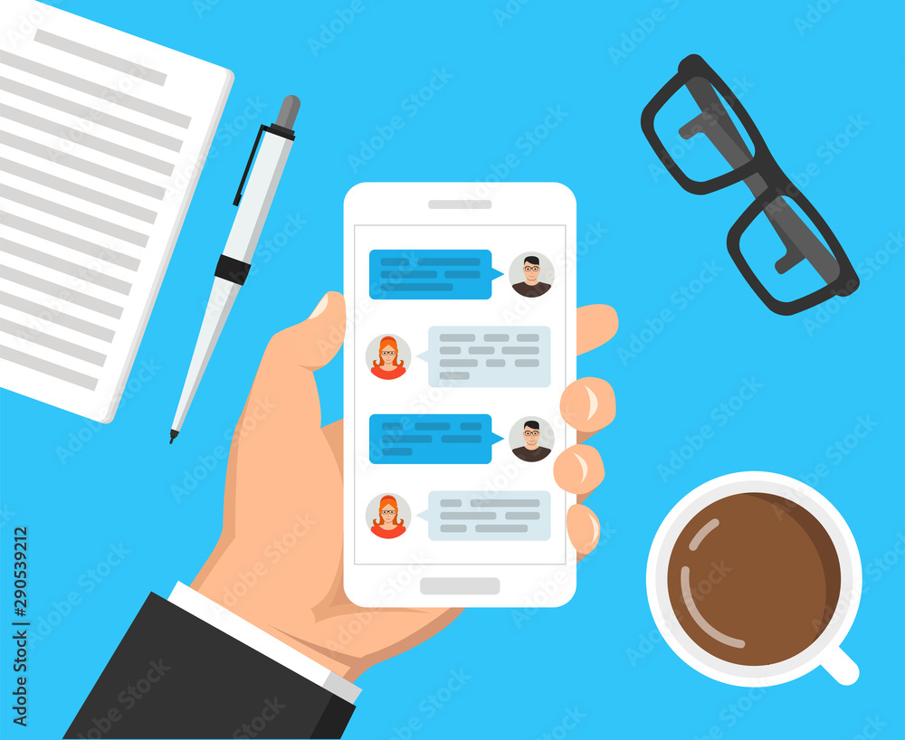 Poster hand holding smartphone with text messaging on the screen. сup of coffee, notebook with pen and glas