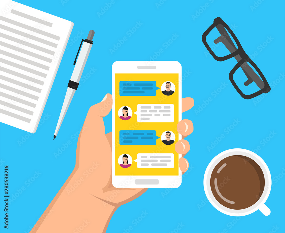 Poster hand holding smartphone with text messaging on the screen. сup of coffee, notebook with pen and glas