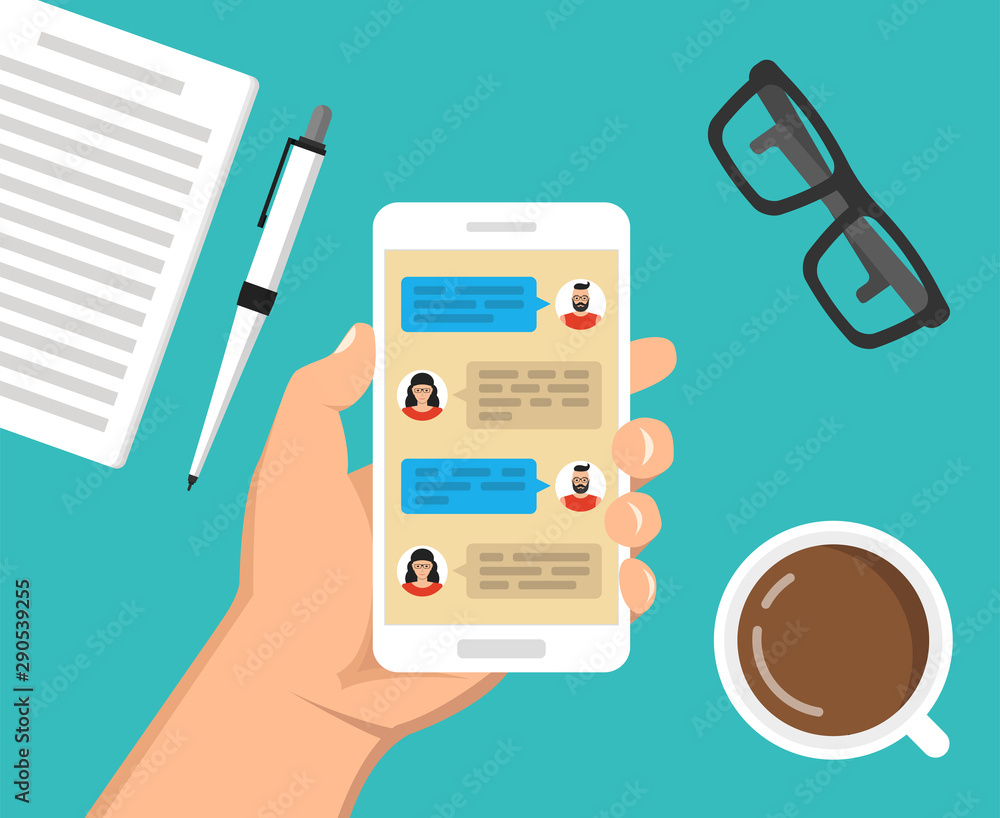 Poster hand holding smartphone with text messaging on the screen. сup of coffee, notebook with pen and glas