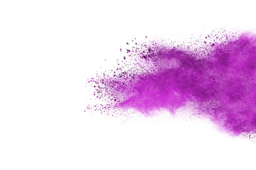 Freeze motion of purple color powder exploding on white background.