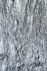 The texture of aluminum foil. Crumpled foil.