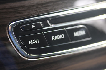 Luxury vehicle infotainment buttons