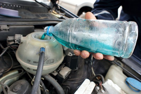 Car Servicing, Adding Antifreeze To Car Engine