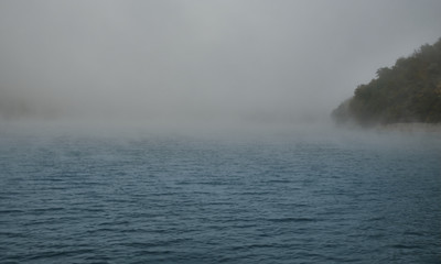Obraz premium Autumn lake in Kamchatka is covered with fog. Lake Kamchatka autumn