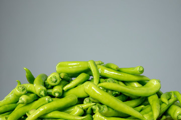 Sweet green peppers on the grey isolated background
