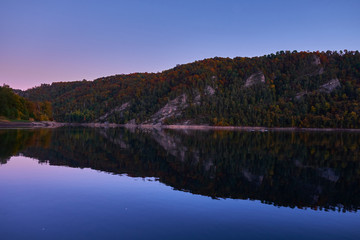 Autumn lake in Kamchatka among the mountains and forests. the nature of Kamchatka