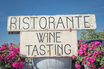 Wine tasting sign in the countryside - Tuscany, Italy
