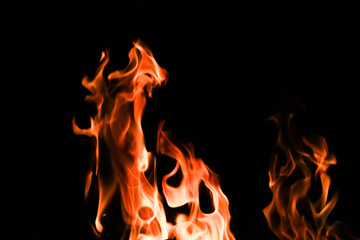 Fototapeta premium Fire flames on black background