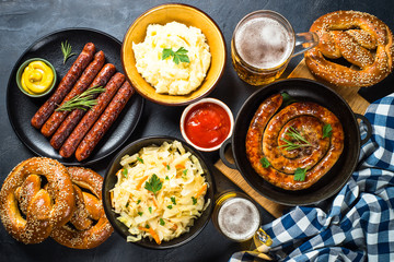 Oktoberfest food - sausage, beer and bretzel.