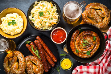 Oktoberfest food - sausage, beer and bretzel.