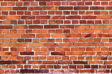 Detailed view on aged and weathered red brick walls at historical buildings in high resolution