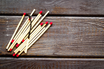 Matches for danger concept on wooden background top view mockup