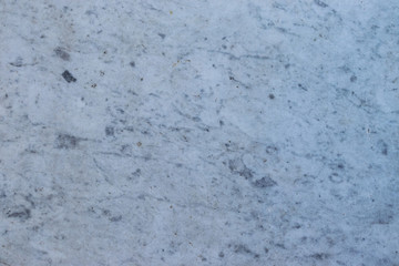 Background in the form of a marble surface of light color with a bluish tint