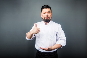 An Asian male chef，Gray background