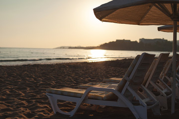 free sun loungers and sunbeds on the beach. bright soft photo