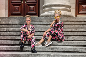 Mother and daughter having fun in same outfits. Fashionable family - Image